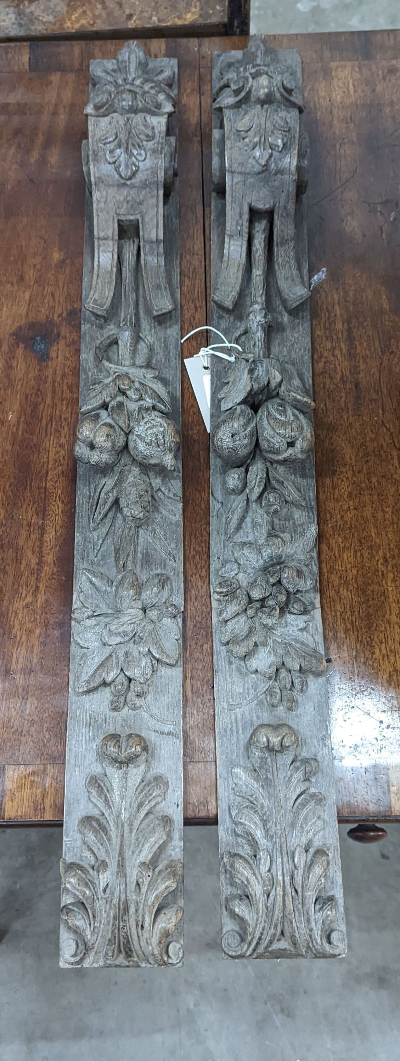 A pair of 19th century carved oak appliques, height 80cm
